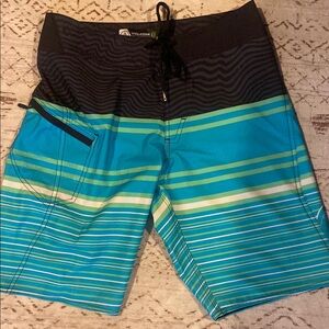Volcom Black and Blue Board Shorts with Dynamic Stripes
